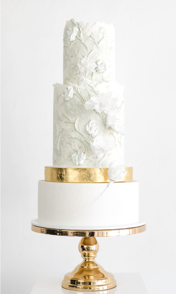 3 tier fondant wedding cake with gold spacer and texture buttercream flower pattern