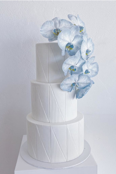 white fondant line with blue orchids