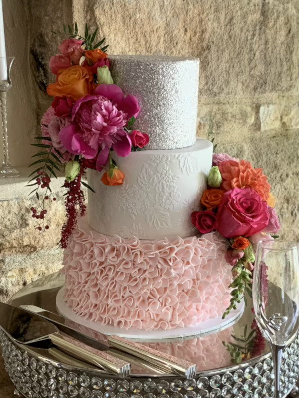 pink ruffles, middle tier white with stencil work and silver glitter on top tier